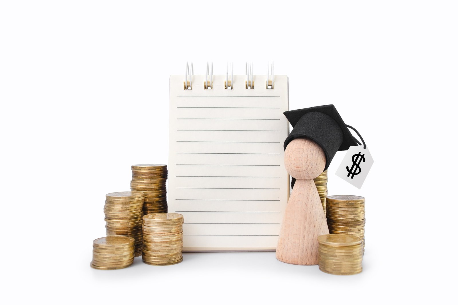 Concept of financial literacy and education. Wooden man with graduation cap with dollar sign